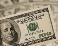 الدولار ينخفض إلى أدنى مستوياته في أسبوع